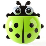 Toothbrush and toothpaste holder, ladybug, green color